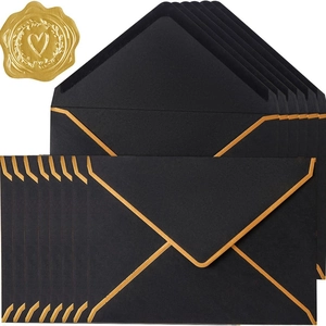 Elegant black envelope set with gold foil edges and a heart-pattern wax seal accent