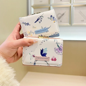 Three-fold floral mini wallets with heart metal clasp in pink and blue floral patterns