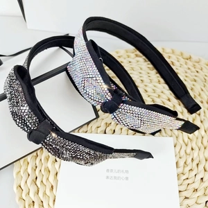 Eleganti cerchietti con fiocchi di strass scintillanti in argento e grigio scuro