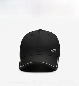 Detail of black sports baseball cap with white mountain peak embroidery and light piping