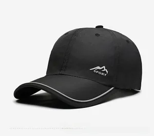 Detail view of quick-dry sports cap with mountain logo and reflective stripe edge