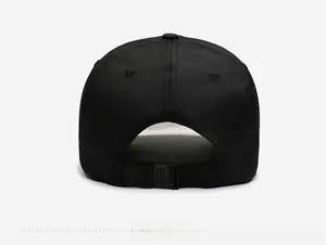Close-up of black baseball cap back with adjustable plastic buckle and twill fabric