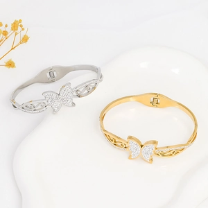 Titanium steel butterfly bangle set with sparkling crystals on artistic white display