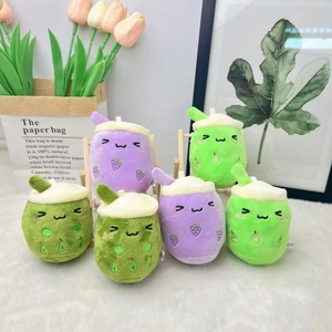 Detail of plush milk tea cup pendants in purple and green with soft embroidery