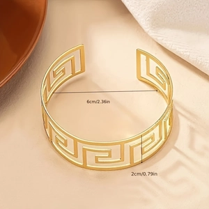 Wide gold cuff bracelet with Greek fret pattern and open design, 2cm width and 6cm diameter