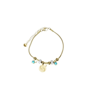 Golden evil eye bracelet with turquoise beads and crystal accents on white background