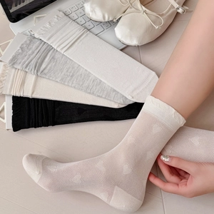 Sheer silk mesh socks with heart patterns and ruffled cuffs in four classic colors