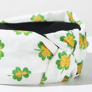 Detailed close-up of clover print fabric knot headband with soft fabric texture