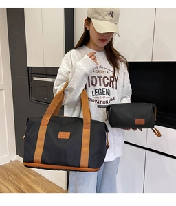 Two-piece travel set featuring a large waterproof black duffel bag and small toiletry pouch