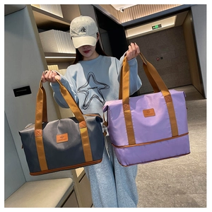 Dual-color large capacity nylon travel bags in charcoal grey and soft purple with wide handles