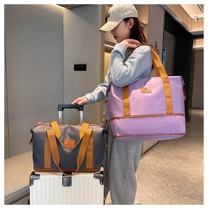 Dual-layer travel bag with luggage sleeve showing purple and grey nylon expandable designs