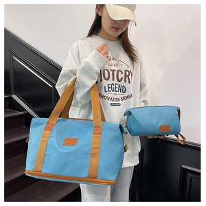 Blue double-layer travel tote and cosmetic bag set with durable orange webbing handles