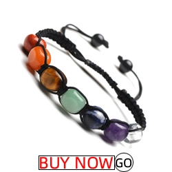 Detail of 7 chakra natural stones on a black braided adjustable cord bracelet