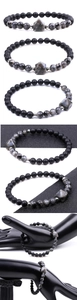 Dettaglio macro delle perle a piramide da 6mm in occhio di tigre e ametista sul bracciale
