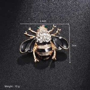 Detail showing dimensions of gold bee brooch with rhinestones and black enamel wings