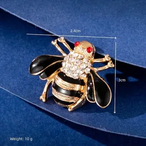 Detailed view of bee brooch showing 2.4cm width, 3cm height, and 10g weight specifications