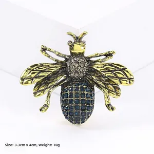 Detailed view of enamel bee brooch with 3.3cm x 4cm dimensions and crystal inlay details