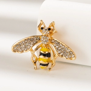 Cute bee brooch with yellow black enamel and sparkling crystals on golden base