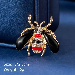 Golden bee brooch with black enamel wings and sparkling rhinestones 3x2.8cm