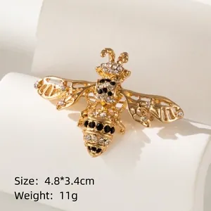 Golden bee brooch with black and white rhinestones, size 4.8x3.4cm, weight 11g