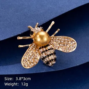 Cute bee-shaped brooch with large pearl and sparkling rhinestones for clothing decor