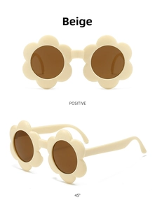 Vue détaillée des lunettes de soleil fleurs beiges pour enfants avec verres ronds à 45°