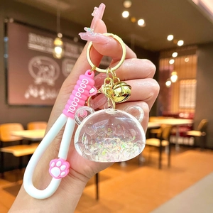 Süßer Bär-Schlüsselanhänger mit rosa Katzenpfote und glitzerndem Treibsand-Anhänger