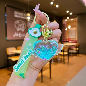Dettaglio portachiavi a cuore con sabbie mobili blu e cinturino Sweet Heart