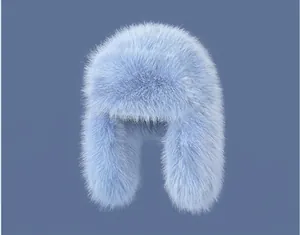 Detailed close-up of fluffy light blue faux fur texture on a thick winter trapper hat