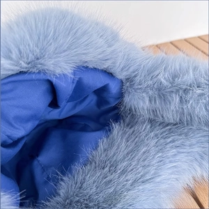 Detail of blue faux mink fur texture with soft satin lining on winter thermal hat