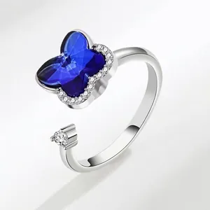 Rotating copper spinner ring with blue butterfly crystal and zircon stones
