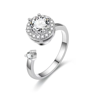Rotating silver open ring with cubic zirconia main stone and pavé halo setting