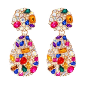 Detailed view of colorful rhinestones and multi-shape crystals on bohemian earrings
