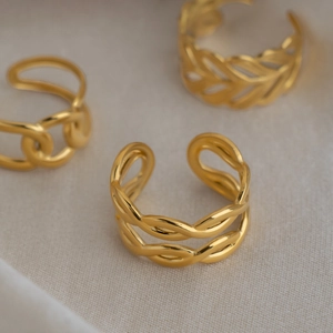 Detailed close-up of 18K gold-plated double-layer braided and chain-link open rings