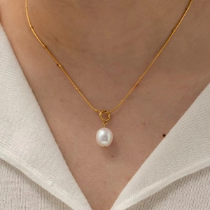 Minimalist gold satellite chain necklace with a single white freshwater pearl pendant