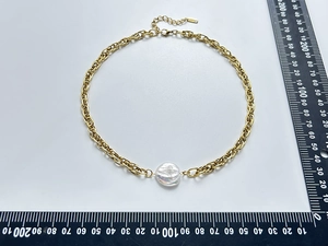 Detailed size measurement of a gold chain necklace with a natural baroque pearl pendant