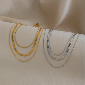 Three-layer minimalist gold and silver blade snake chain necklace set in polished steel