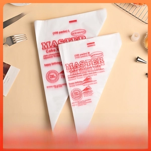 Close-up of clear disposable pastry bags with red patterns and 100-piece pack labels