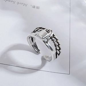 Close-up of S925 sterling silver stamp on vintage chain link ring with padlock detail