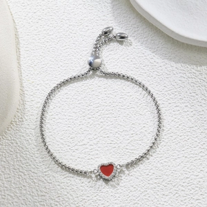 Close-up of adjustable silver box chain with red heart pendant and white zircon inlay