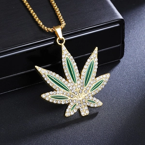 Hip hop maple leaf necklace in gold with green enamel and sparkling white zircons