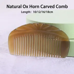 Natural engraved ox horn hair comb with sun pattern detail in semi-transparent brown finish