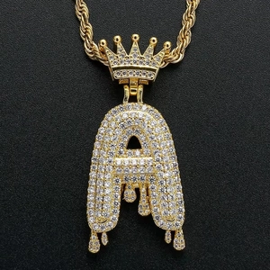 Gold hip hop initial A pendant with crown and dripping design on a rope chain