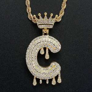 Close-up of hip-hop letter C pendant with crown detail and shimmering zircon stones
