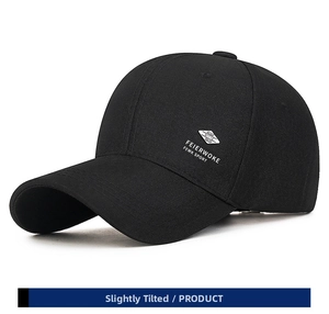 Detail of black sports baseball cap showing white Feierwoke logo and twill cotton texture