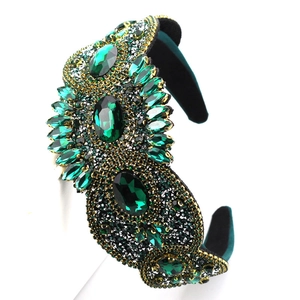 Luxury Baroque headband with emerald green glass gems and gold beads on velvet