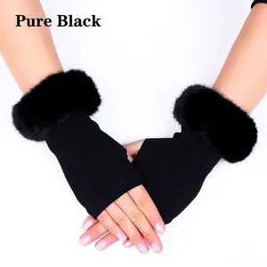 Detail of fingerless knit gloves featuring chic black faux fur cuffs and a sleek texture