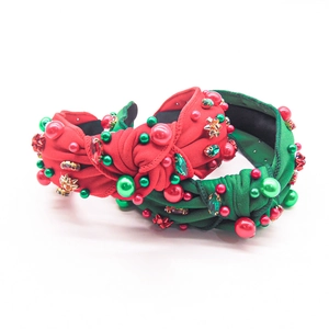 Detail of Christmas headbands with red and green fabric, rhinestones and faux pearls