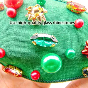 Green knit Christmas headband with festive red pearls and sparkling glass rhinestone
