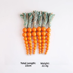 Detail of 22cm wooden carrot bead garland set with measurements and green tassel